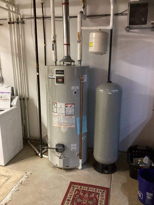 Completed plumbing membership maintenance visit. Inspected water heater system including main tank, expansion tanks, and associated piping/valves to verify proper operation. Performed visual inspection of commercial restroom fixtures including ADA-compliant toilet and safety grab bars to ensure functionality.