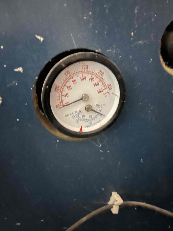 Responded to service call for boiler with illuminated red warning light. Diagnosed low water level and low pressure conditions. Performed necessary adjustments to restore proper pressure levels as confirmed by pressure gauge readings.