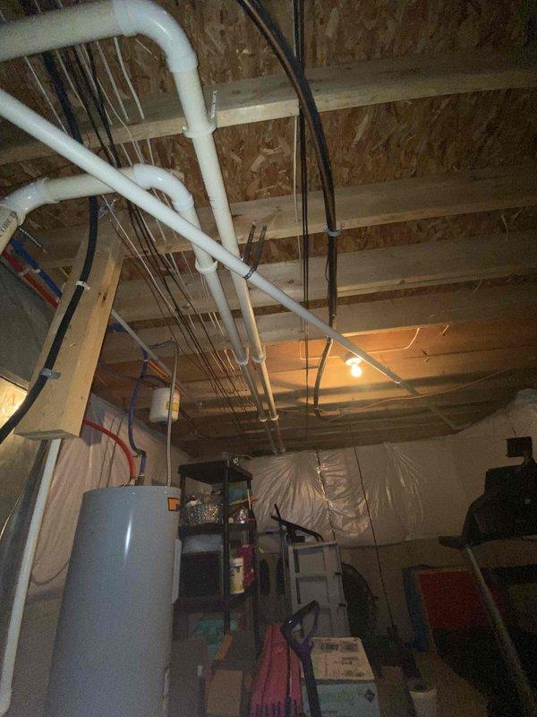 Conducted estimate for furnace replacement in residential basement. Current system includes metal HVAC unit with connected ductwork and PVC ventilation lines. Evaluation included assessment of existing installation, ductwork condition, and available utility connections in the unfinished basement space.