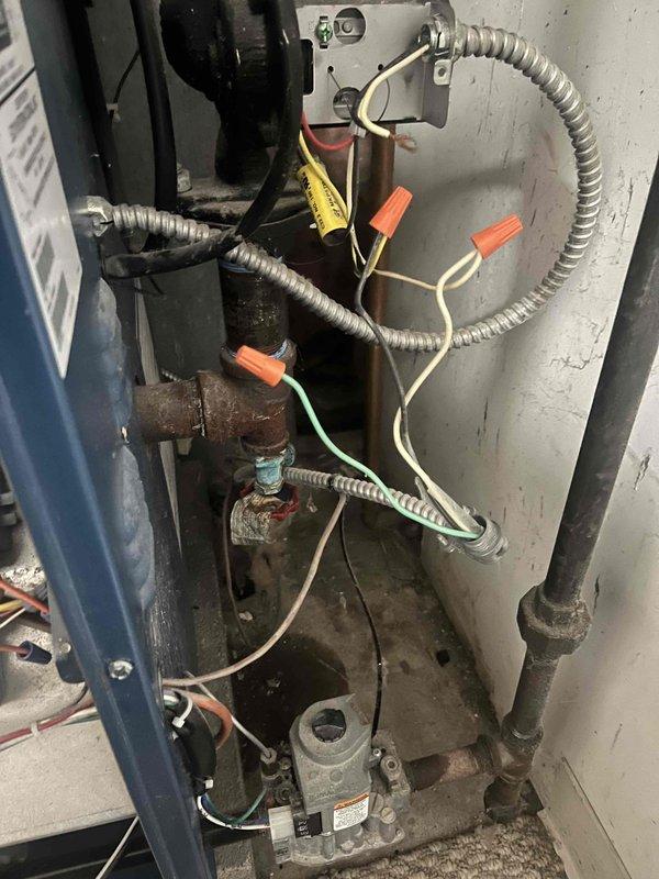 Responded to recurring issue at customer's property via garage access. Conducted thorough inspection of aging boiler system showing significant wear. Identified electrical connection problems with multiple wires requiring proper termination and replacement of corroded piping components. System restored to proper functioning condition after component replacement and electrical repairs.