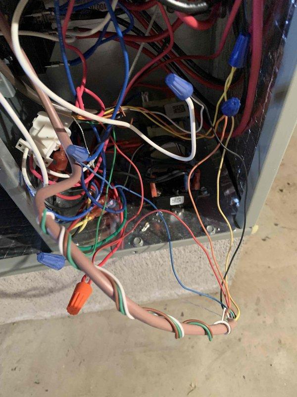 Successfully completed the installation of a smart WiFi thermostat as previously sold by Sam. Verified proper wiring connections at both the HVAC control panel and thermostat terminal block, ensuring correct wire placement to terminals including R, O/B, Y, G, and C. Confirmed functionality of the heat pump system and instructed customer on basic operation of the new WiFi-enabled device.