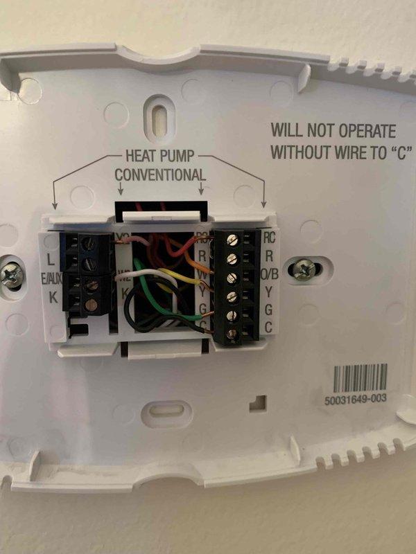 Successfully completed the installation of a smart WiFi thermostat as previously sold by Sam. Verified proper wiring connections at both the HVAC control panel and thermostat terminal block, ensuring correct wire placement to terminals including R, O/B, Y, G, and C. Confirmed functionality of the heat pump system and instructed customer on basic operation of the new WiFi-enabled device.