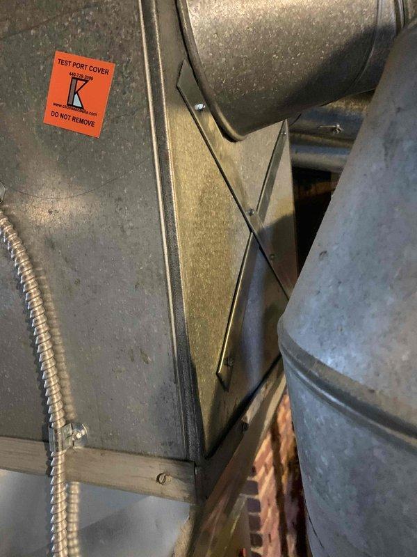 Responded to callback for noise complaint - customer reported "thunk" sound when furnace cycles off. Inspection revealed inadequate ductwork reinforcement causing metal expansion/contraction noise. Installed X-bracing on sheet metal panels and verified proper test port cover placement to eliminate the noise issue.