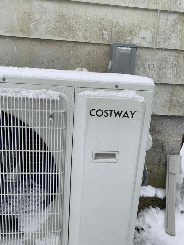 Responded to customer complaint of mini-split system error code indicating high pressure switch off. Observed COSTWAY mini-split system with significant frost/snow accumulation on outdoor unit. System was installed by homeowner in exterior office space. Performed defrost cycle and cleared ice buildup from outdoor unit to restore proper operation and resolve high pressure fault.