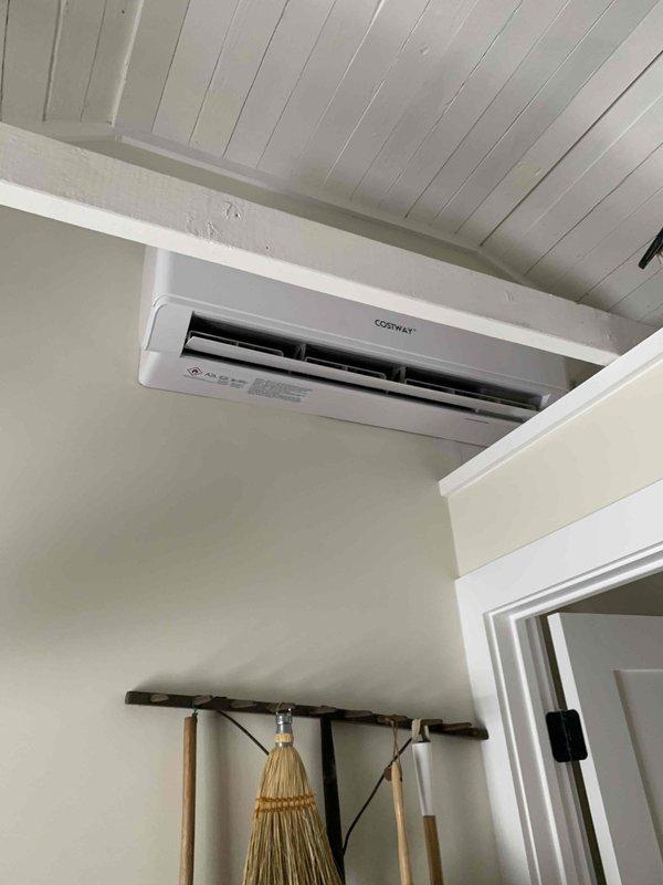 Responded to customer complaint of mini-split system error code indicating high pressure switch off. Observed COSTWAY mini-split system with significant frost/snow accumulation on outdoor unit. System was installed by homeowner in exterior office space. Performed defrost cycle and cleared ice buildup from outdoor unit to restore proper operation and resolve high pressure fault.