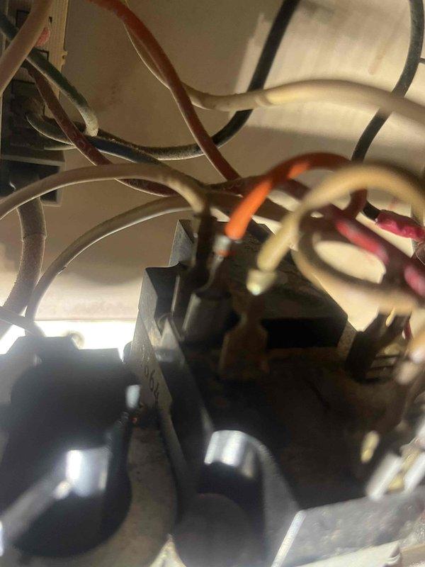 Diagnosed furnace malfunction by inspecting internal electrical components. Found loose and corroded wire connections at terminal block. Cleaned connection points and secured all wiring to restore proper electrical flow, successfully returning unit to normal operation.