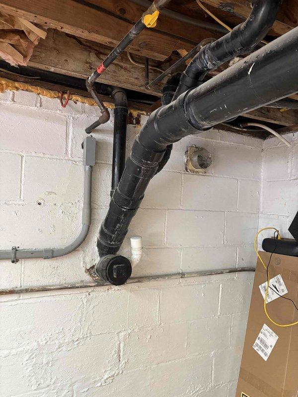 Responded to emergency service call for a burst pipe in the basement. Upon inspection, found significant corrosion on copper supply line causing failure. Shut off main water supply to prevent further damage, removed damaged section of pipe, and replaced with new PVC piping including proper fittings and connections. System was tested for leaks and proper function after repair was completed.