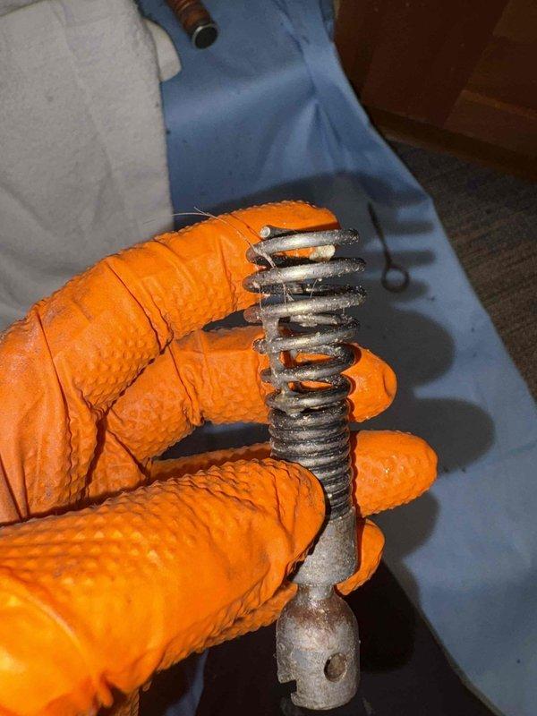 Responded to kitchen sink drainage issue at Stephen Yutzy residence. Upon inspection of the InSinkErator Evolution PRO 750 garbage disposal, discovered severely corroded internal spring mechanism causing the blockage. Removed and replaced the damaged component, restoring proper drainage function to the kitchen sink system.