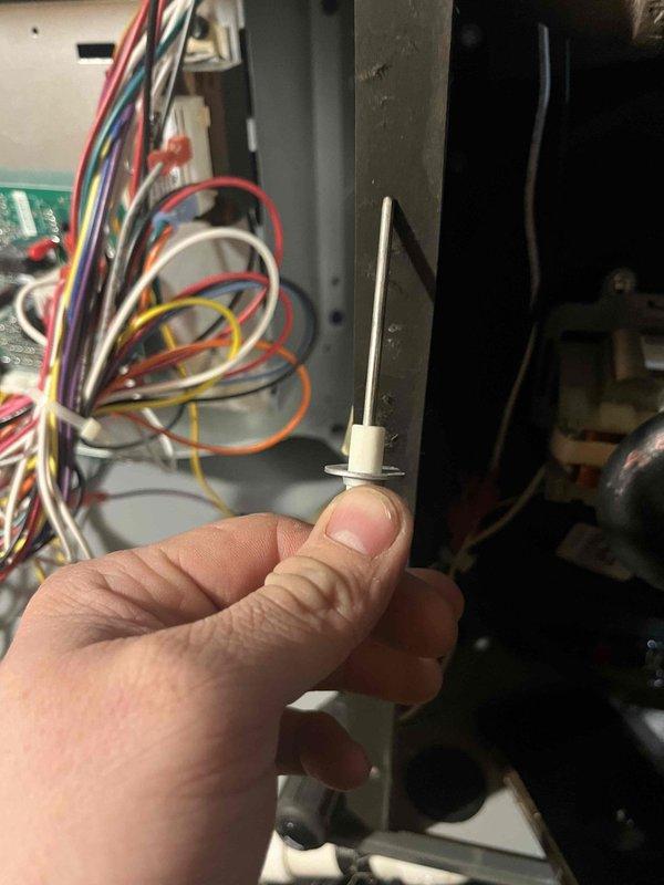 Diagnosed and serviced 3-year-old furnace that was not maintaining set temperature and cycling off prematurely. Inspected air filter which showed significant dust accumulation reducing airflow. Removed and cleaned flame sensor/igniter assembly found in control panel, which was causing improper flame detection and system shutdowns. System now operating correctly and maintaining desired temperature.