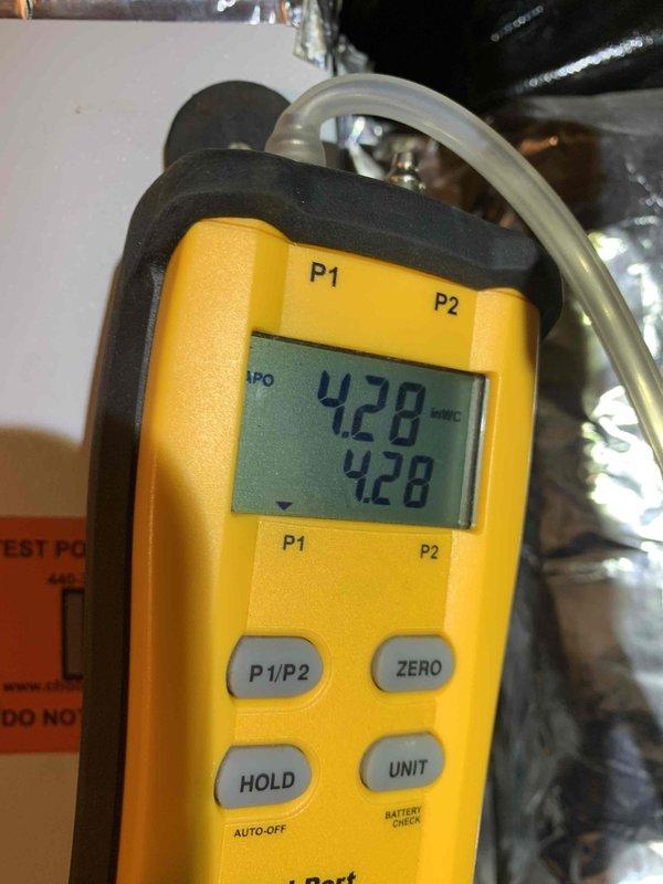 Responded to cooling issue where thermostat was set to 78°F but space temperature was 72°F with system blowing cold air. Performed gas pressure verification using dual port manometer (readings 327-329 inH2O and 4.28" WC) and adjusted fan speed on air handler to correct the performance issue.