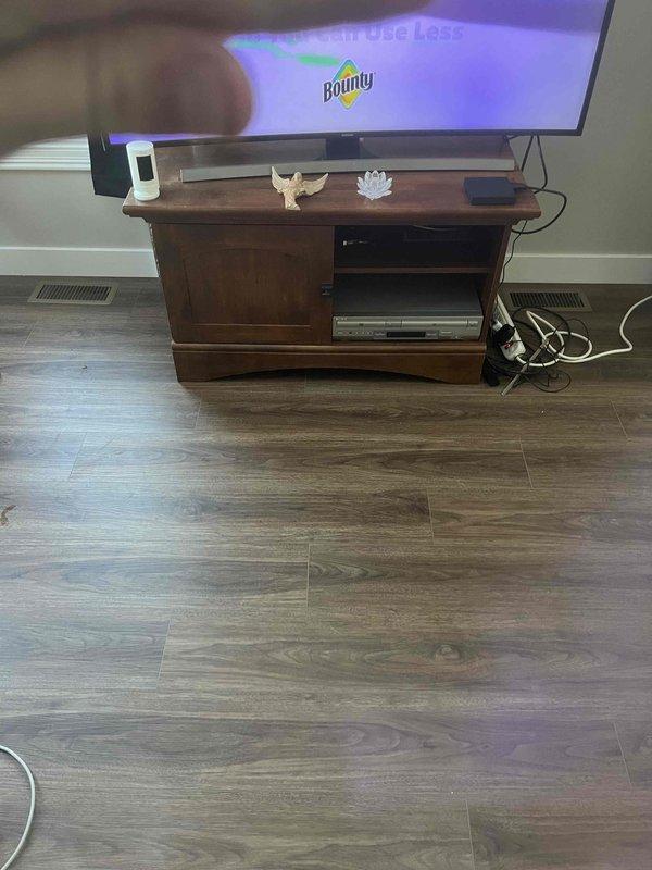 Installed a 6" ductwork run from basement to living room through closet, connecting to a newly installed wall register. Extended and upgraded the duct size to 7" as per previous consultation, enhancing airflow to the entertainment area.