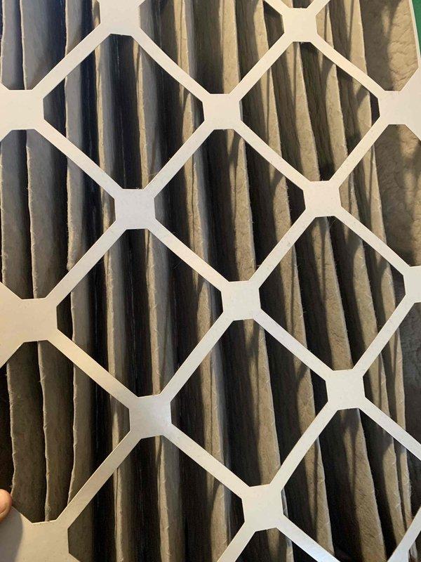 Responded to no-heat call and diagnosed failed flame sensor on furnace. Testing revealed low microamp reading of 3.7 μA, indicating poor flame detection. Replaced severely clogged air filter which was restricting airflow and contributing to system malfunction. System now operating normally after cleaning flame sensor and restoring proper airflow.