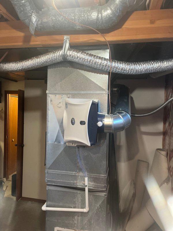 Successfully completed the follow-up service call to install a new humidifier unit on the customer's HVAC system as sold by Jeff. Mounted the replacement humidifier to the side of the central air handler, ensuring proper connection to the existing ductwork and securing all flexible metallic duct connections with appropriate tape. Connected the water supply line using copper piping with brass fittings to provide adequate water delivery to the humidification system.