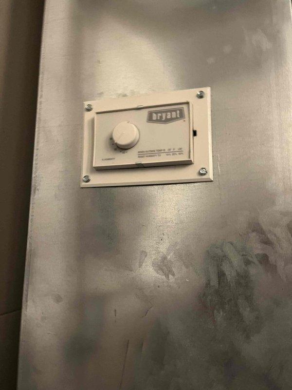 Responded to service call for Bryant system not reaching setpoint temperature (68°F showing only 60°F). Inspected thermostat control and accessed furnace interior for diagnostic evaluation. Observed Aprilaire unit with proper flame pattern in burner assembly. System was operational but underperforming. Contacted dispatch (Laureen) for follow-up scheduling to address temperature differential issue.