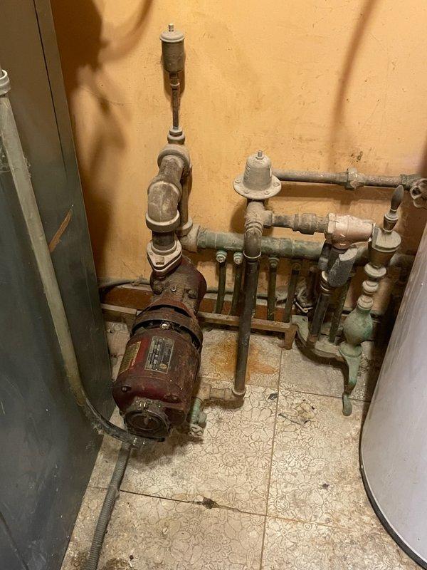 Responded to no heat complaint in residence with indoor temperature at 48°F. Diagnosed failure of circulator pump on aging Crane oil boiler system. Replaced defective 65W circulator pump, purged air from system, and verified proper operation of heating system with multiple zone functionality restored.