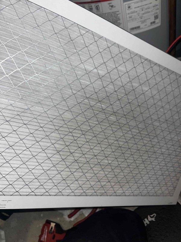 Performed comprehensive tune-up on 15-year-old air handler. Replaced air filter with new clean unit featuring diamond-pattern mesh design. Inspected ignition system components including electrode/igniter and verified proper connection of pipe assembly with rubber gaskets and metal clamps. All systems functioning within normal parameters after service.