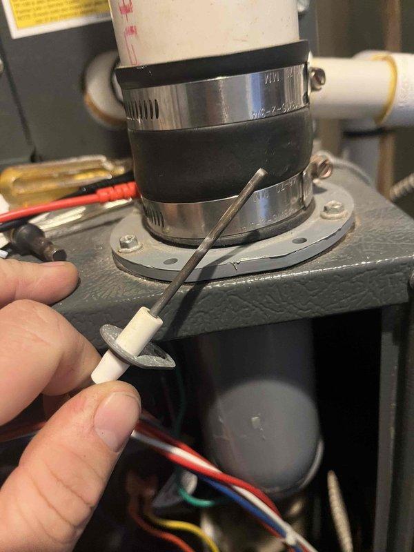 Performed comprehensive tune-up on 15-year-old air handler. Replaced air filter with new clean unit featuring diamond-pattern mesh design. Inspected ignition system components including electrode/igniter and verified proper connection of pipe assembly with rubber gaskets and metal clamps. All systems functioning within normal parameters after service.