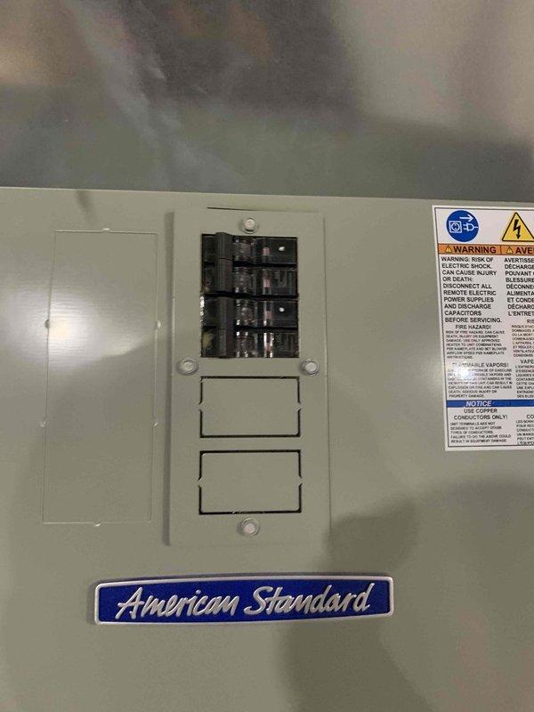 Responded to service call for 5-year-old heat pump system not reaching set temperature despite recent thermostat replacement. Diagnostic inspection revealed the system was properly engaging auxiliary heat mode (confirmed on Honeywell Home thermostat display showing "AUX Heat On") when attempting to raise temperature from 67°F to 72°F. Inspected American Standard electrical panel for proper connections and operation. System now functioning correctly with appropriate temperature differential.