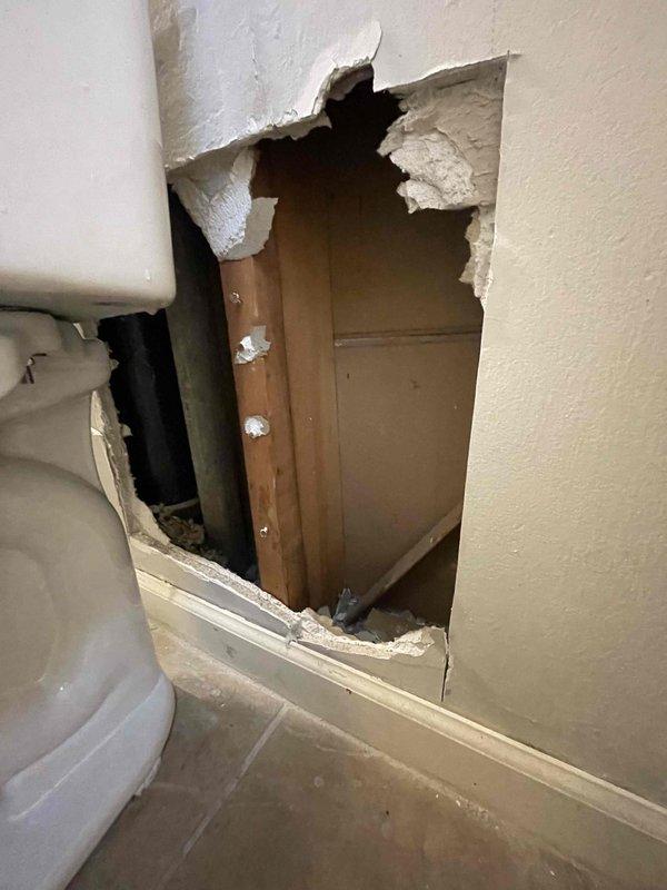 Completed installation of new sanitary stack repipe as previously sold. Work involved accessing plumbing through bathroom wall adjacent to toilet and installing new PVC drainage system in basement area with proper joints and connections to existing plumbing infrastructure. All vertical and horizontal sections were properly secured to structural framing.