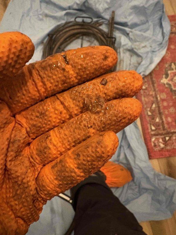 Responded to service call for clogged kitchen sink drain. Performed diagnostic inspection, accessed cleanout port, and utilized drain snake equipment to successfully clear blockage. Verified proper drainage function after service completion.