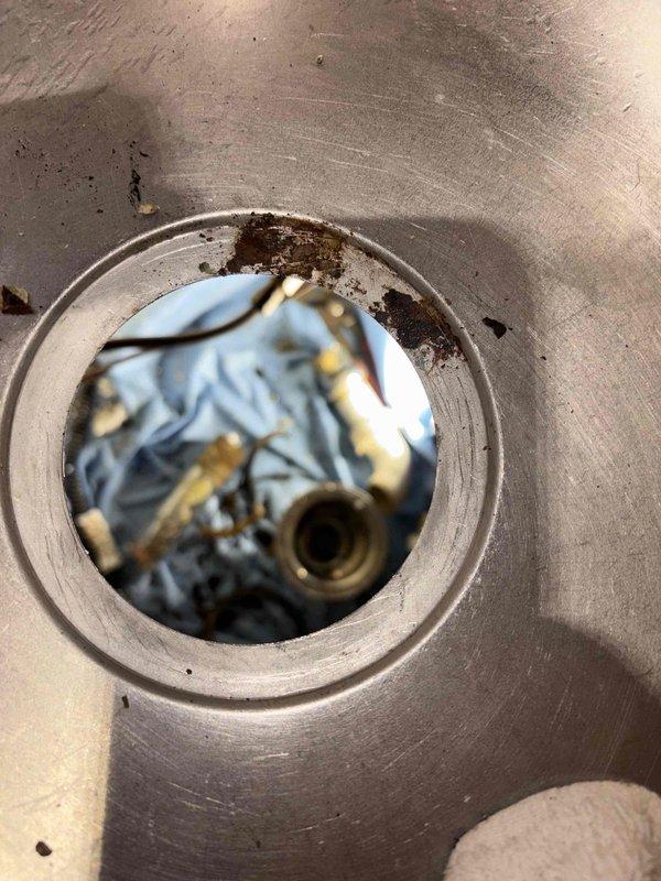 Responded to service call for clogged kitchen sink drain. Performed diagnostic inspection, accessed cleanout port, and utilized drain snake equipment to successfully clear blockage. Verified proper drainage function after service completion.