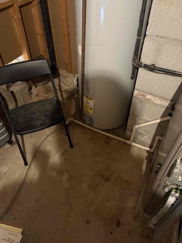 Inspected 35-year-old gas furnace with air conditioning system that customer reports is struggling to maintain temperature. Visual examination revealed multiple holes in the heat exchanger as previously identified by another technician. Documented extensive condensation on metal surfaces and photographed the current system configuration in preparation for full system replacement recommendation.