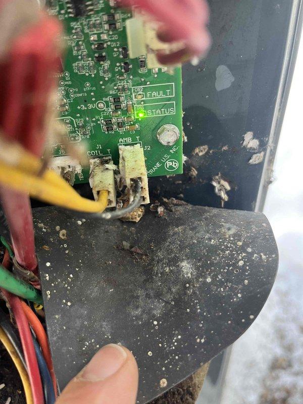 Diagnosed a 2017 American Standard heat pump system operating exclusively in auxiliary mode, maintaining 67-68°F with 65W auxiliary heat consumption. Inspection revealed significant corrosion and dirt buildup on the control board terminals, particularly affecting the status indicator and default settings. Documented evidence of compromised electrical connections and circuit board deterioration, which was causing the system to bypass normal operation and default to auxiliary heat mode.