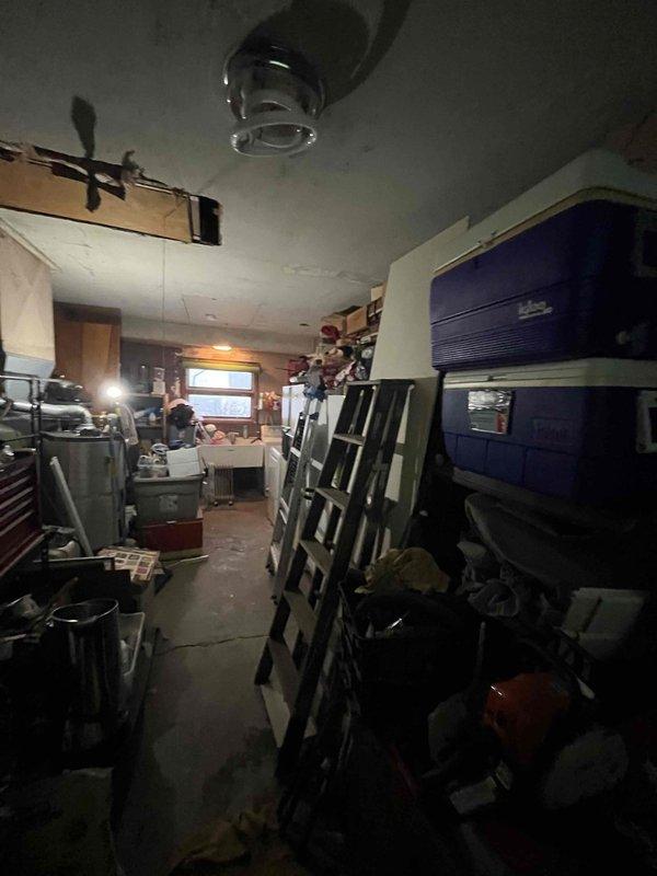 Conducted inspection of client's non-functional water treatment system. Observed electrical issues including exposed wiring at wall outlet with visible damage to surrounding drywall. Evaluated installation area in workshop/garage which contains adequate space for new system replacement. Provided estimate for complete water treatment system replacement.