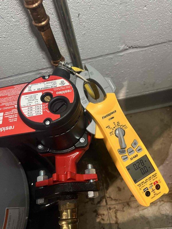 Diagnosed garage heating system failure caused by non-functioning Taco circulation pump. Verified pump was receiving proper power (2.8A) but not circulating water. System pressure reading at 80 PSI confirmed adequate pressure. Replaced defective circulation pump to restore proper water flow and heat to garage zone.