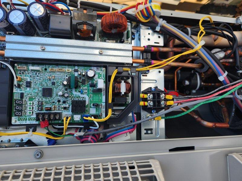 Replaced defective Daikin outdoor condenser unit under warranty. Installed new unit on existing pad and reconnected electrical components and refrigerant lines. System is now operational with proper airflow and electrical connections verified.