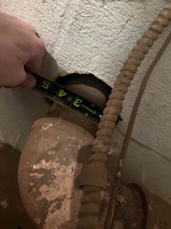 Conducted site inspection at NurseryTech to evaluate existing boiler system requiring repair. Documented significant pipe deterioration and corrosion, with measurements taken of clearance gaps between ceiling and damaged copper piping. Assessed mechanical room containing aging circulation pumps and associated plumbing infrastructure. Prepared comprehensive estimate for boiler repair options and additional quote requested for garage bay area heater installation.