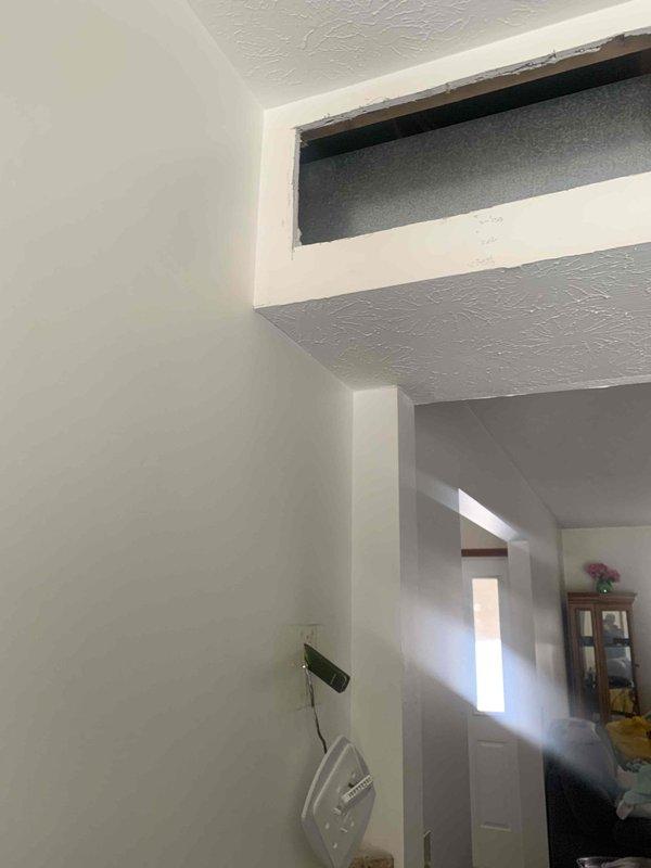 Returned to residence to address ongoing thermostat issue under warranty. Diagnosed system functionality by timing operation cycles. Inspected interior wall cavity near thermostat installation area to verify proper wiring and mounting conditions. Issue persists; further investigation required.