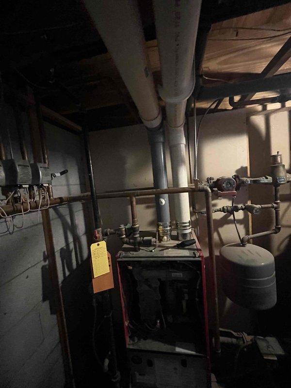 Responded to no heat call for 12-15 year old boiler showing no lights and potential condensate drain clogging. Visual inspection confirmed improper drainage issues. Recommended and scheduled comprehensive system flush and preventative maintenance to restore proper operation and prevent future failures.