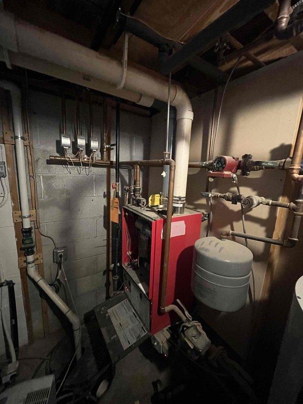 Responded to no heat call for 12-15 year old boiler showing no lights and potential condensate drain clogging. Visual inspection confirmed improper drainage issues. Recommended and scheduled comprehensive system flush and preventative maintenance to restore proper operation and prevent future failures.