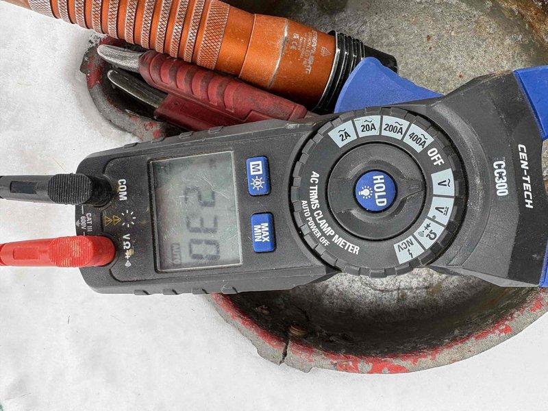 Responded to service call for complete loss of water pressure (0 PSI on gauge). Inspected Well-X-Trol pressure tank and associated plumbing components. Performed electrical testing using CEN-TECH clamp meter to verify proper pump operation. Diagnosed and resolved pressure issue, restoring system functionality.