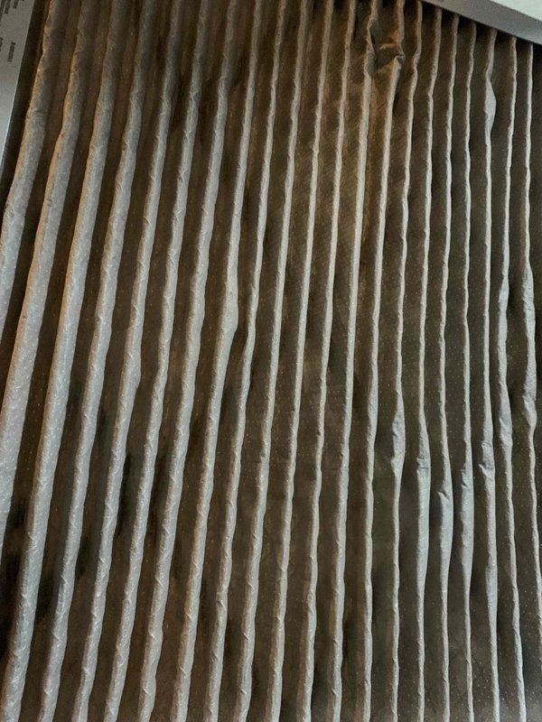 Responded to no-heat complaint for 5-6 year old gas furnace where system was clicking on but producing burning odor in basement. Inspection revealed severely clogged air filter causing restricted airflow. Replaced dirty filter with new one, restoring proper airflow and eliminating burning smell. System now operating normally with appropriate heat distribution.