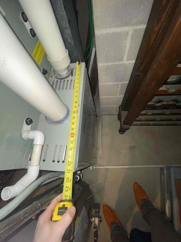 Conducted assessment for whole home humidifier installation in client's basement utility area. Measured existing HVAC equipment and evaluated available installation space adjacent to the furnace unit. Inspected current plumbing configuration and PVC pipe network to determine optimal connection points for the proposed humidification system.