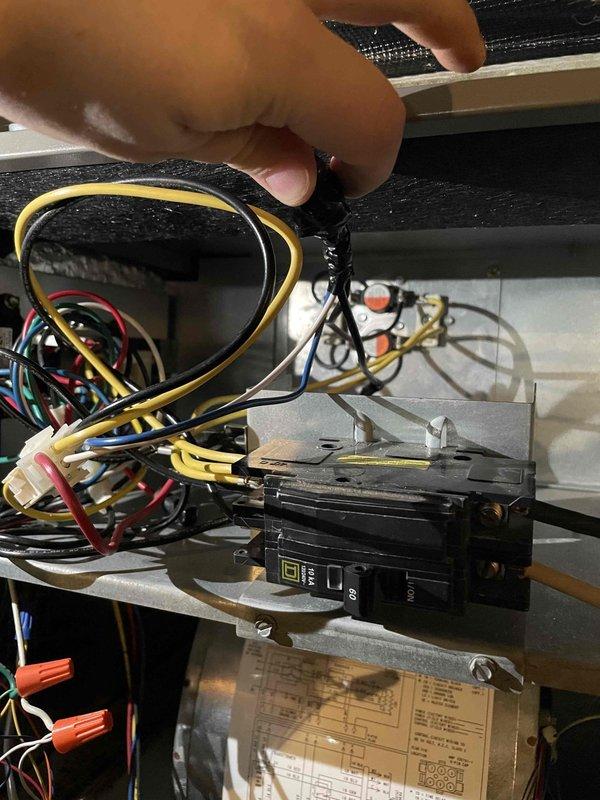 Responded to no heat call for heat pump system with air handler. Diagnosed electrical issue at the circuit breaker panel. Performed voltage testing with Fieldpiece SC640 multimeter, confirming power supply irregularities. Restored proper electrical connection to restore heating function.