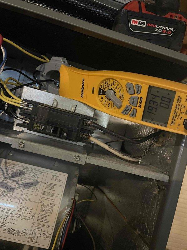 Responded to no heat call for heat pump system with air handler. Diagnosed electrical issue at the circuit breaker panel. Performed voltage testing with Fieldpiece SC640 multimeter, confirming power supply irregularities. Restored proper electrical connection to restore heating function.