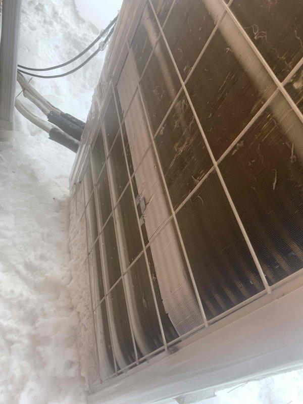 Responded to no heat call for Pioneer ducted mini split system. Upon arrival, home temperature was 62°F despite thermostat being set to heat mode. Discovered outdoor unit was severely restricted by snow accumulation against coils, limiting proper heat exchange. Cleared snow from around the unit, inspected refrigerant lines, and performed system charge verification. System operation restored after proper airflow was established around the outdoor condenser.