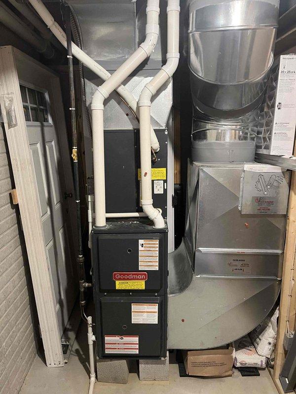 Diagnosed Goodman furnace with no heat issue. Identified failed control board. Replaced with compatible universal control board, restoring system functionality and heat to home. Photos documented original Emerson board (part #150-2315) and complete furnace installation with PVC venting.