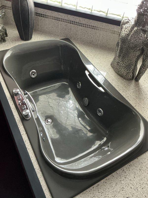 Responded to member's report of a running Gerber toilet. Inspected plumbing fixtures and connections, including water supply lines and P-trap, finding them in good condition with no signs of corrosion or leaks. Also examined the jacuzzi-style bathtub and its jet system. Customer was advised that their humidifier concerns would require HVAC specialist attention due to visible corrosion.