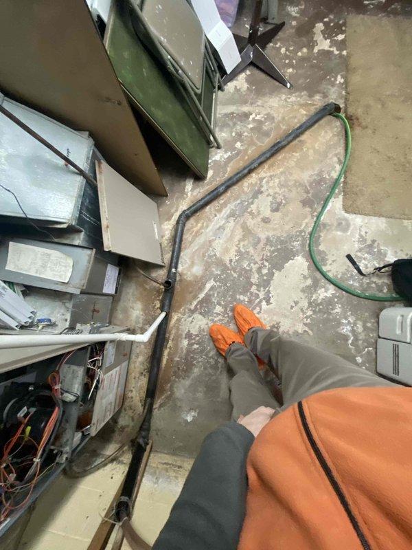Responded to a lead from Sam K regarding no heat issue. Inspected furnace in unfinished basement with exposed joists and plumbing infrastructure. Diagnostic review indicated unit requires replacement; photos documented current installation conditions including nearby electrical panel and water treatment equipment.