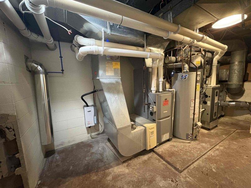 Returned to property for tankless water heater installation previously sold by Justin. Completed installation of unit in basement mechanical room, connecting to existing PVC venting system. System was properly mounted, plumbed, and tested for operation with appropriate clearances maintained from other mechanical equipment.