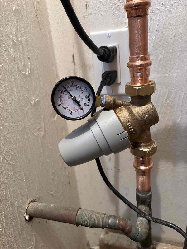 Responded to service call for water hammer issues following recent PRV installation. Diagnostic inspection revealed pressure fluctuations between 70-90 PSI causing pipe knocking. Adjusted pressure regulator valve to stabilize system pressure within normal operating range, eliminating water hammer effect. Verified proper operation of recently installed pressure release valve.