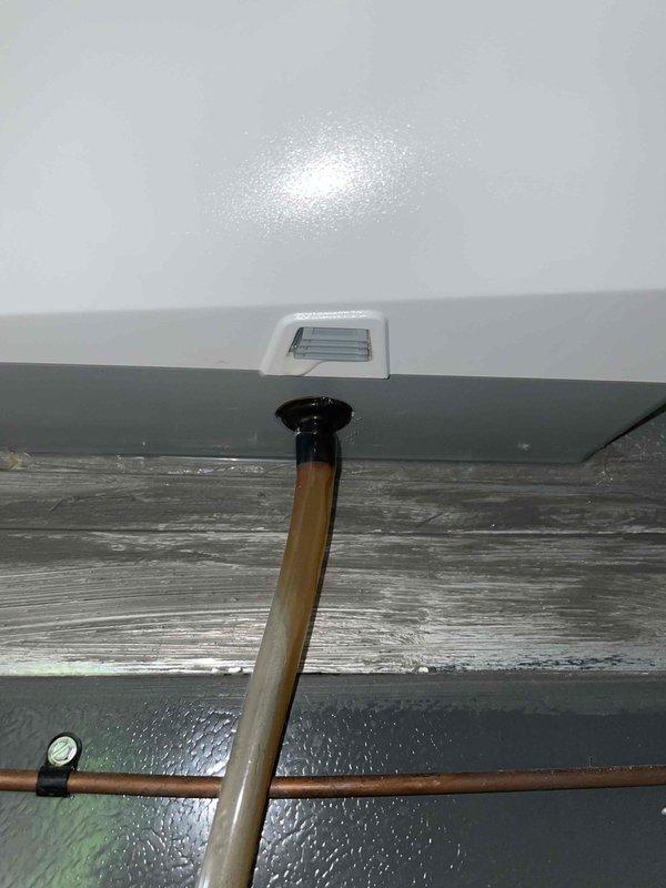 Diagnosed water accumulation under the furnace air handler. Inspected drainage system and documented condition of filter and drain connection. Recommended maintenance to prevent future water issues.