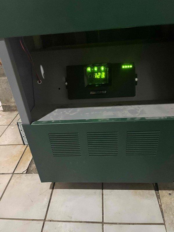 Successfully replaced defective zone control board under warranty. New board installed and tested on all five zones (Living Room, Front Basement, Offices, East Wing, and Garage). System functioning properly with normal temperature readings displayed on control panel.