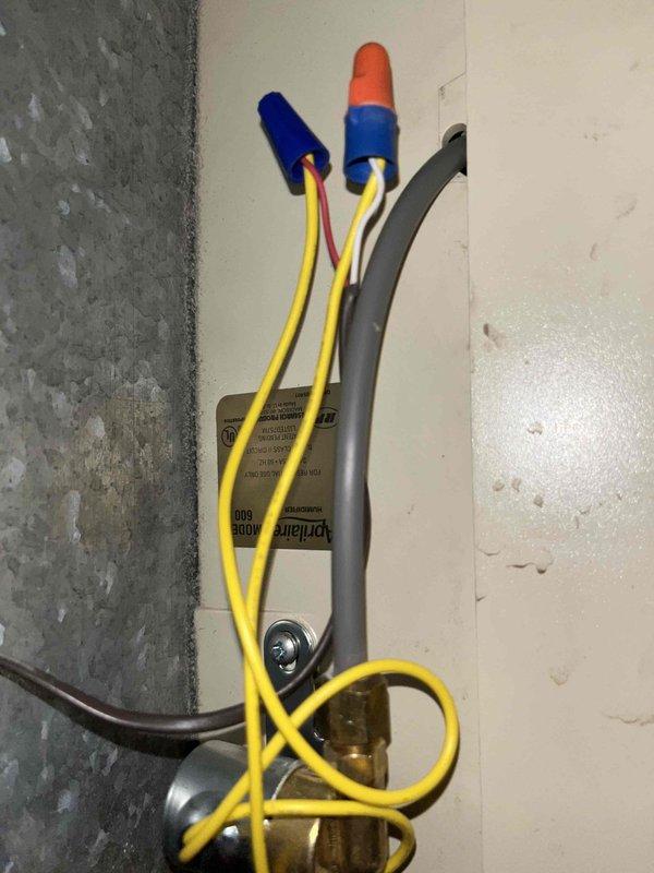 Recommissioned AprilAire humidifier that was previously disconnected during water heater replacement. System was properly reconnected and filter access issue resolved to restore normal operation.