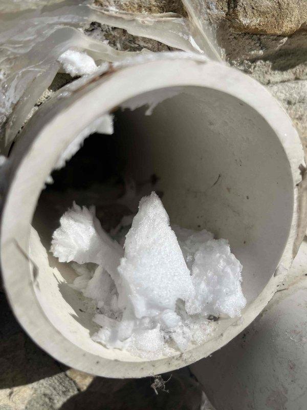 Responded to callback for non-functioning furnace. Inspection revealed significant ice buildup in condensate drain pipe, causing system blockage. Cleared frozen condensate line and restored proper drainage, allowing furnace to resume normal operation.