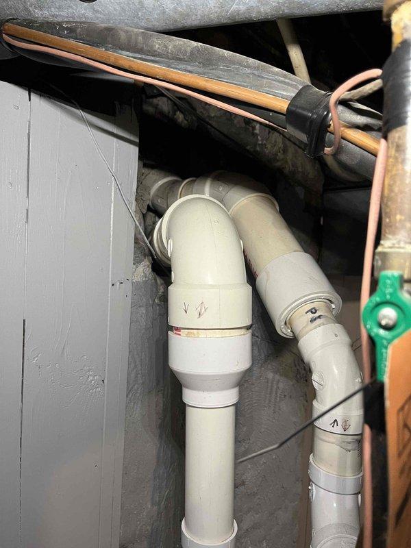 Investigated water drip from HVAC exhaust vents using inspection camera, which revealed deterioration at pipe joint with visible mold/corrosion. Inspected PVC drainage system and copper supply lines, addressing the leak at connection point to restore proper system operation.